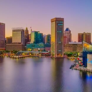 city skyline across body of water during daytime